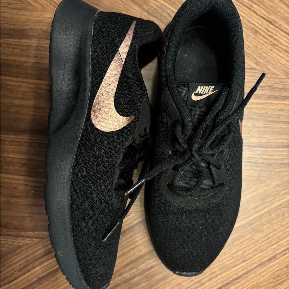 Nike sneakers, black and bronze, size 8.